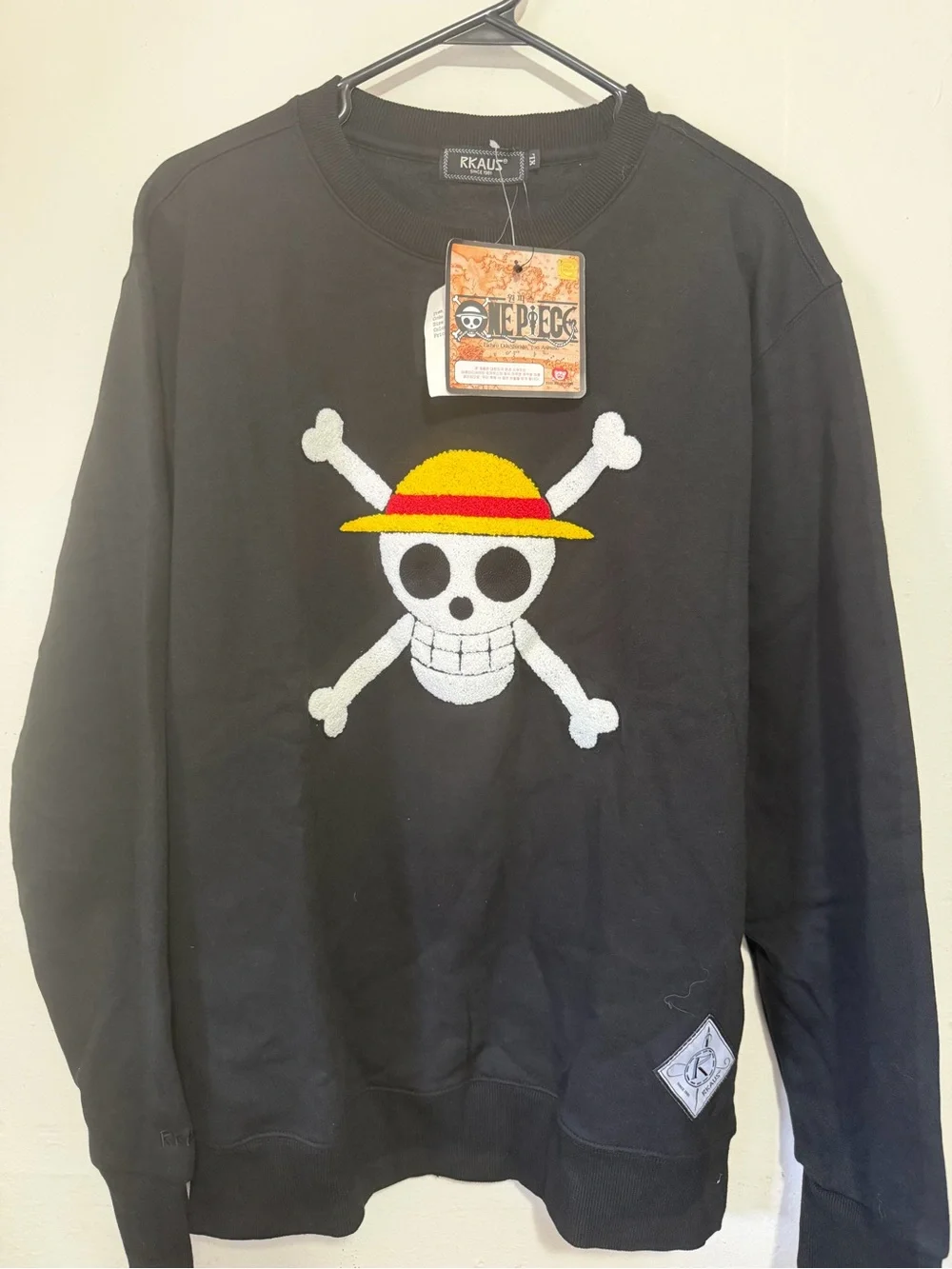 Onepiece Black Crewneck Sweater with Yellow & Red Straw Hat Skull Patch.